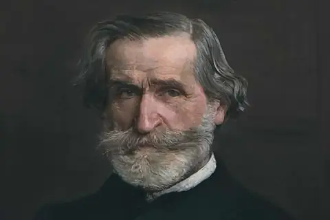 Portret Giuseppe Verdiego, mistrza verdi opery, z siwą brodą i wąsami.
